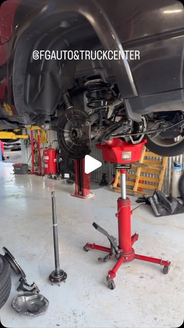 Original FG Reel cover showing work beneath a vehicle in the FG workshop